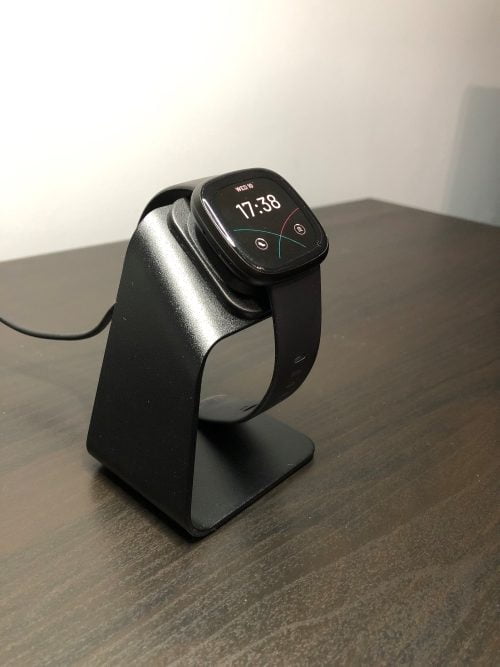 The Fitbit Versa 3 on the KIMILAR charger dock